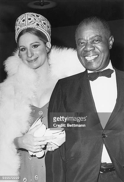 Barbra Streisand and Louis Armstrong at the world premiere of "Hello, Dolly" in New York City. 1969