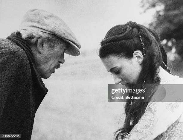 Vienna: With her head bowed, Anjelica Huston listens intently to her father, John Huston, during the filming of 20th Century-Fox "A Walk With Love...