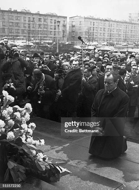 West German Chancellor Willy Brandt kneels in front of the Jewish Heroes monument paying tribute to Jews killed by the Nazis during the 1943 uprising...