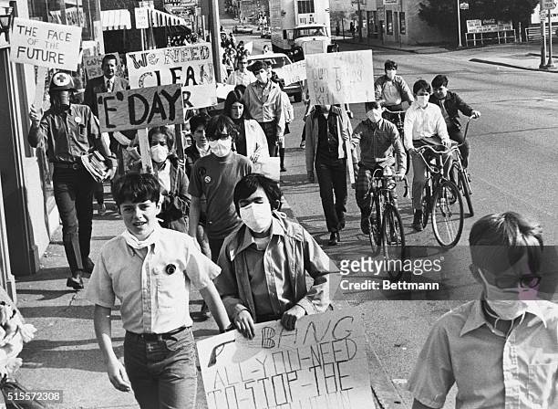 Students at Nipher Junior High School marching through the business district of suburban Kirkwood 4/22 protesting against smog caused by automobiles....