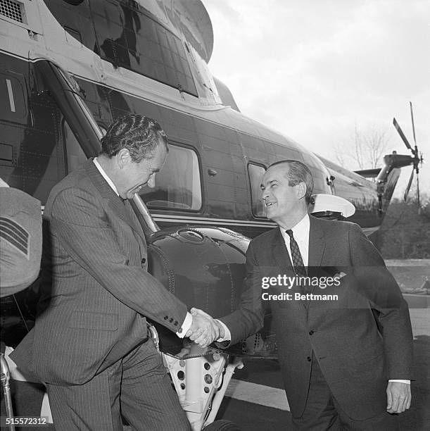 McLean, Va.: President Nixon on his visits to various government agencies, here visiting the CIA. He shakes hands with CIA Director Richard Helms....