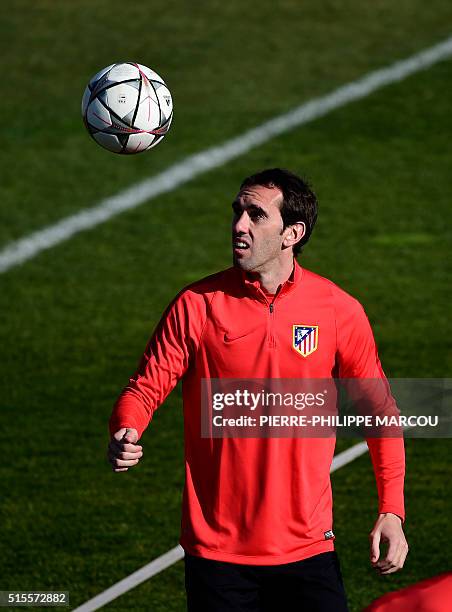 Atletico Madrid's Uruguayan defender Diego Godi eyes the ball during a training session at Wanda Training Complex in Majadahonda, near Madrid, on...