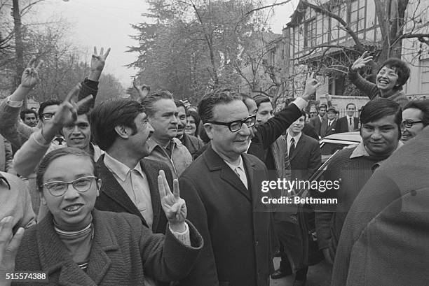 The Marxist candidate for the Chilean presidency Dr. Salvador Allende is surrounded by supporters as he arrives at a polling station, here, Sept....