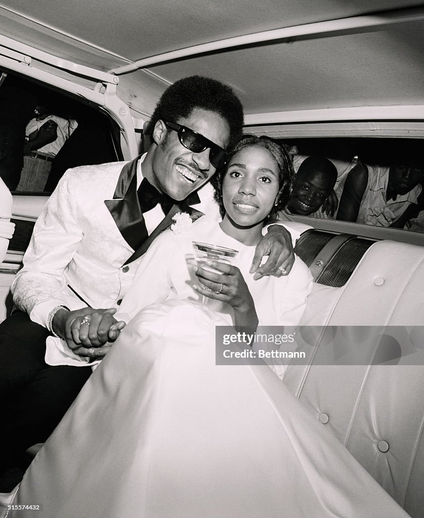 Stevie Wonder and His Bride in Limousine