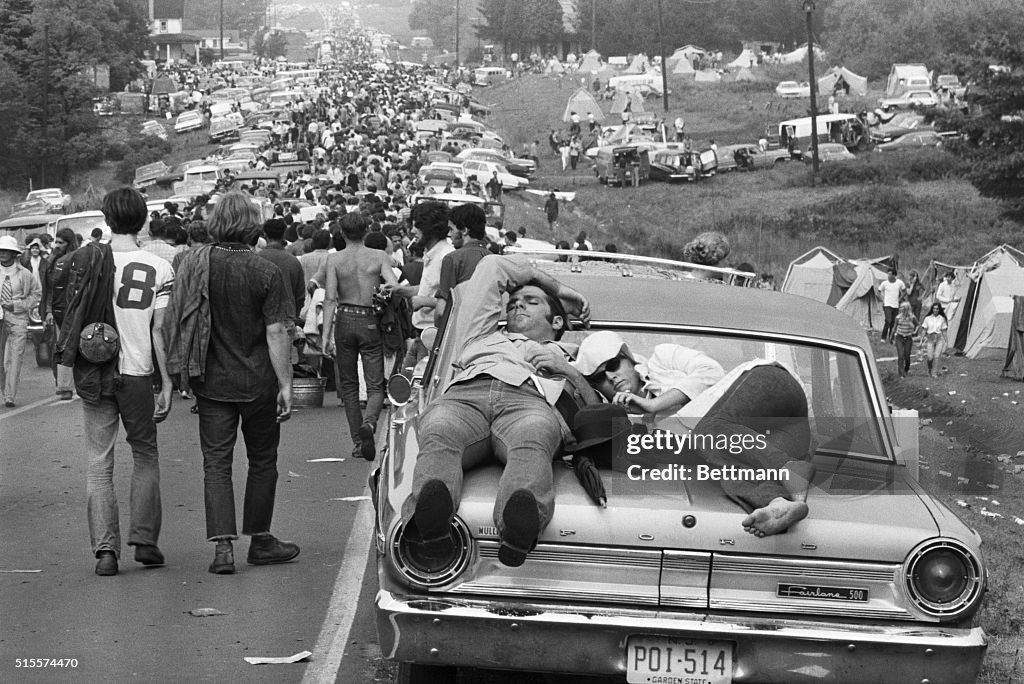 Couple Sleeping on Car at Woodstock, 1969