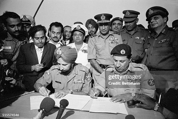 At the Dacca Race Course, Gen. Jagjit Singh Aurora , Chief of Staff of the Indian Army, and General Amir Abdullah Khan Niazi of the Pakistani Army...
