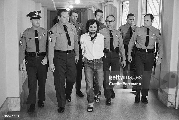 Seven deputies escort Charles Manson from the courtroom after he and three followers were found guilty of seven murders in the Tate-LaBianca slayings.