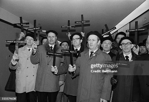 February 2, 1972-Boston: Members of the Boston chapter, Irish Northern aid committee, carry 13 crosses, for the 13 civilians killed by British troops...
