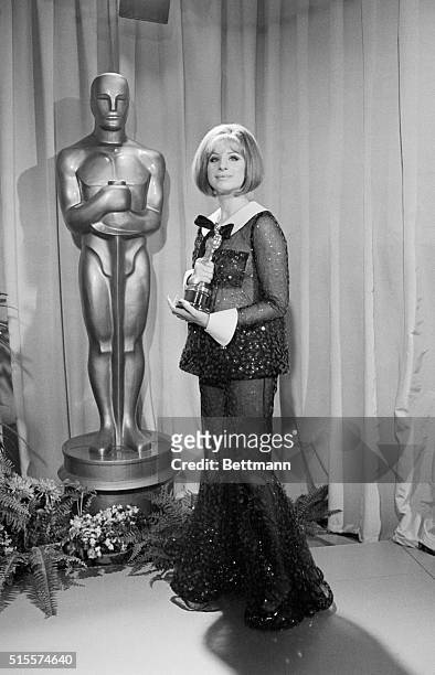 Barbra Streisand with the Oscar she won for Best Actress in Funny Girl. That same year Katharine Hepburn also won Best Actress, a rare split decision.