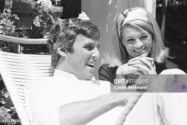 Composer Burt Bacharach and wife, actress Angie Dickinson, review some of Burt's new songs on the patio of their home. Los Angeles, California.