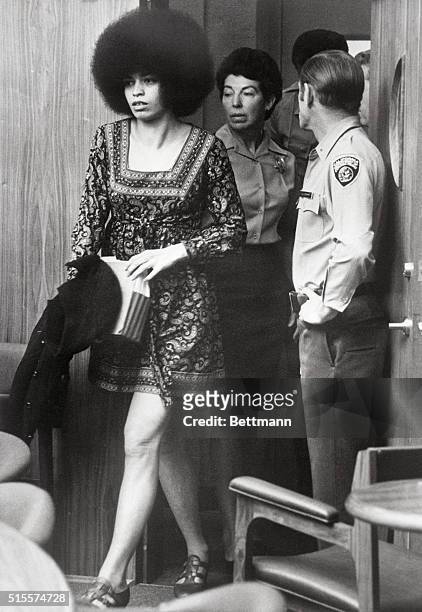 African American activist and Communist intellectual Angela Davis enters a San Rafael courtroom for a pre-trial hearing. She was later tried and...
