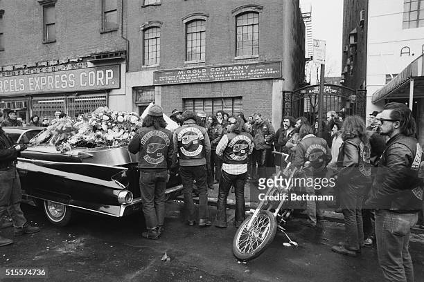 Dozens of Hell's Angels bikers pay a fond farewell to fellow member Jeffrey "Groover" Coffrey, as his coffin slides into a hearse in on the Lower...