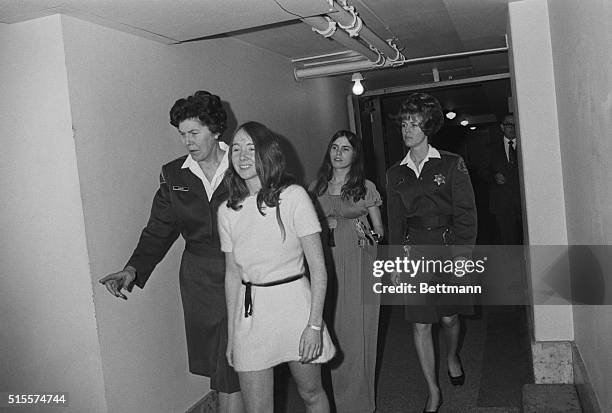 Lynette "Squeaky" Fromme and Ruth Ann Morehouse are led back to jail after being arraigned for conspiring to poison a prosecution witness with LSD....