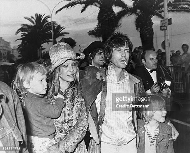 Keith Richard, a member of the Rolling Stones, escorts his partner, actress Anita Pallenberg, and their two children to a screening of Rolling...