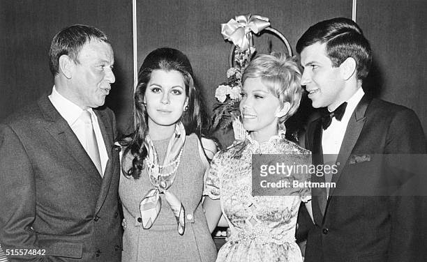 Frank Sinatra and his children Tina, Nancy, and Frank Jr., at the singer's 53rd birthday in Las Vegas.