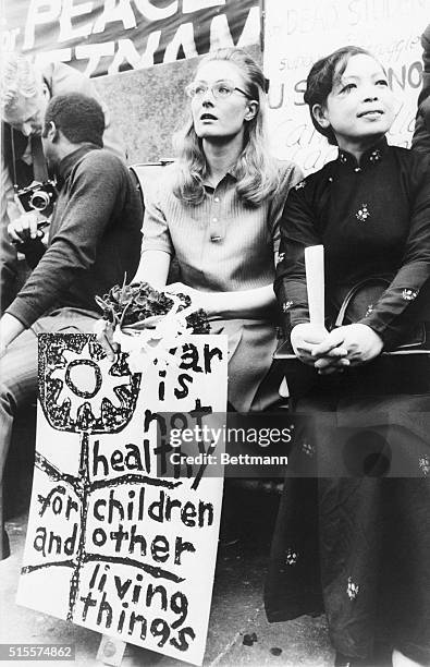 Actress Vanessa Redgrave sits on speakers' stand May 9th during an anti-war protest rally in Trafalgar Square. Next to Miss Redgrave is Madame Linh...