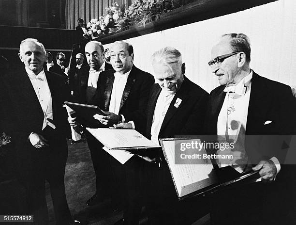 Nobel prize winners Pablo Neruda, Denis Gabor, Dr. Gerhard Herzberg, Dr. Simon Kuznets, and Dr. Earl Sutherland hold their awards after the ceremony...