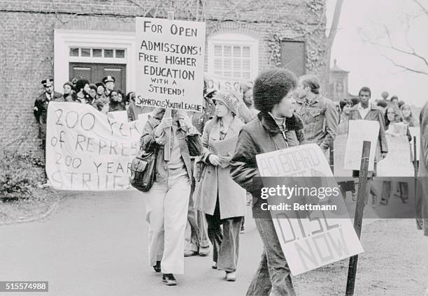 Pickets stand in front and walk around Harvard University's Massachusetts Hall where the office of President Derek Bok is located, 5/2. The students...