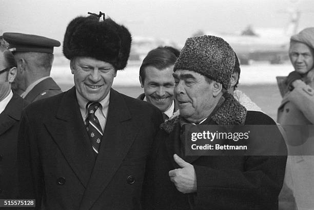 Vladivostok,USSR: Wearing fur hats, Pres. Ford and Soviet Communist Party chief Leonid Brezhnev meet for the first time. The Soviet meeting is the...