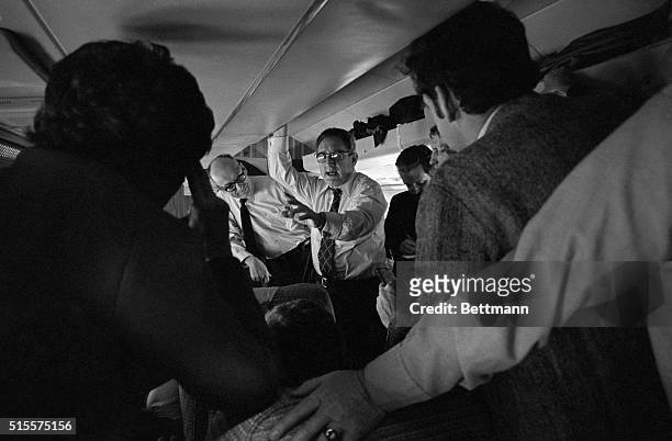 Secretary of State Henry A. Kissinger talks with newsmen enroute to Brussels and the opening session of the North Atlantic Treaty Organization...