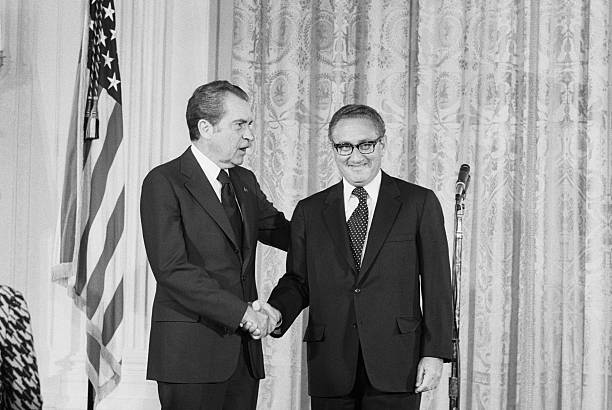 Washington: Pres. Nixon congratulates Henry Kissinger after he was sworn in as secretary of state 9/22 in a ceremony in the East Room of the White...