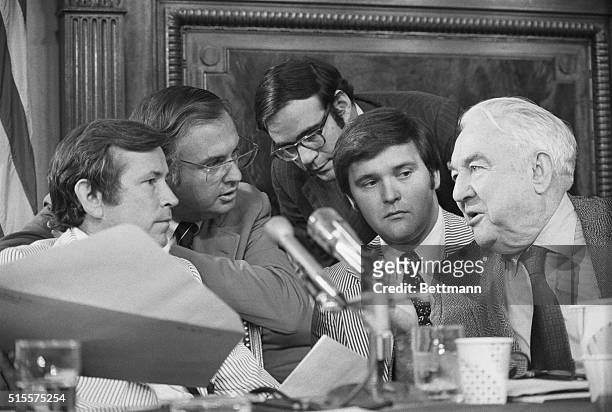 Senate Watergate Committee Chairman Sam Ervin, right, confers with some of his committee and staff members during the hearings 7/18. Left to right...