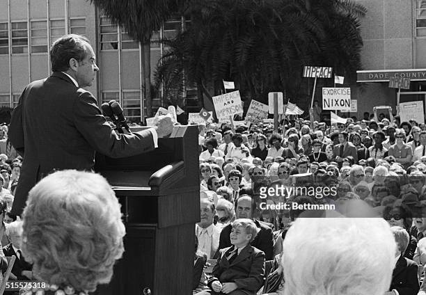 Pres. Richard M. Nixon addresses a gathering at dedication ceremonies of the Cedars of Lebanon Health Care Center. In the background are protesters...