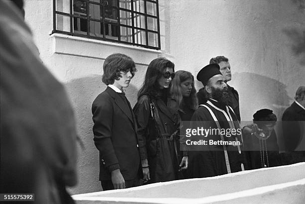 Jacqueline Kennedy Onassis attends the funeral of her second husband Aristotle Onassis, accompanied by her daughter Christine and son John Jr. And...