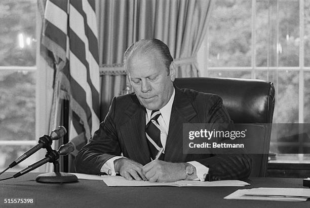 One month after Richard Nixon's resignation over the Watergate scandal, President Ford signs his pardon