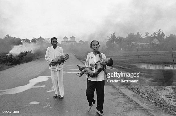 Vietnamese civilians run when their village is accidentally bombed with napalm.