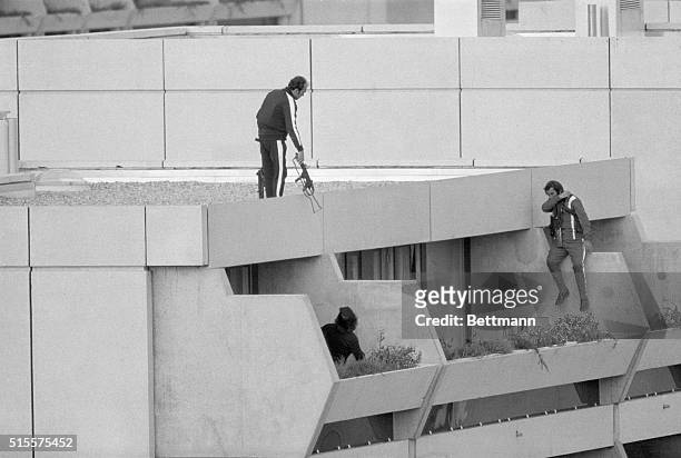 Munich: Armed police drop into position on a terrace directly above the apartments where between nine and 26 members of the Israeli Olympic team are...