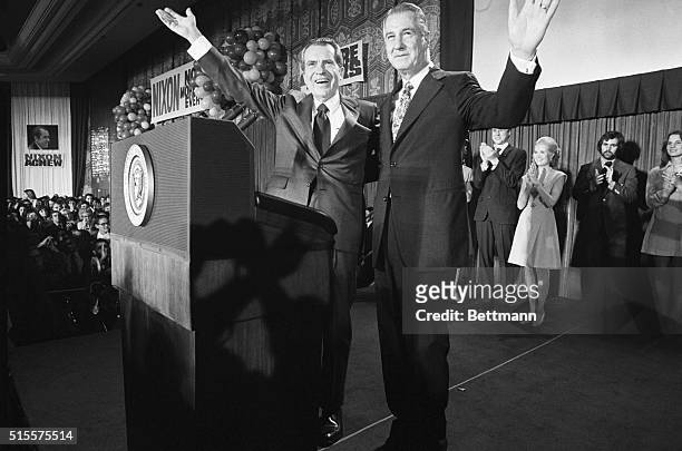 Washington: Pres. Nixon and Vice-Pres. Agnew flash victory smiles as they appear at Republican election night headquarters in the Shoreham Hotel...