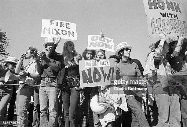 Protesters gather near the White House at the weekend, where they publicize their efforts to have President Nixon impeached. Previously,...