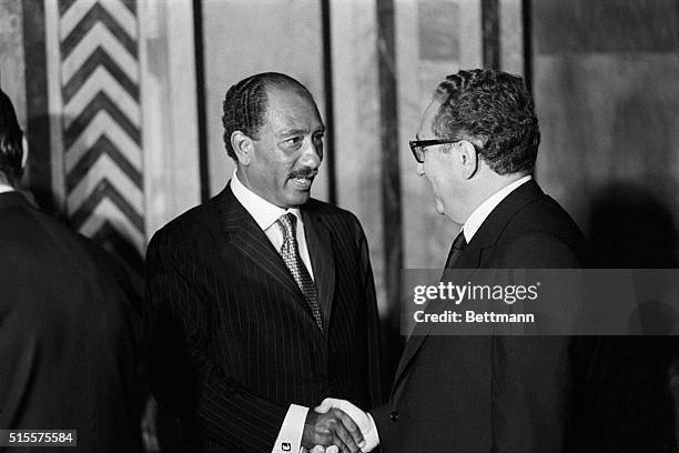 Alexandria, Egypt:President Anwar Sadar shakes hands with US Secy. Of State Henry Kissinger as Kissinger goes through a receiving line at Ras-El-Tin...