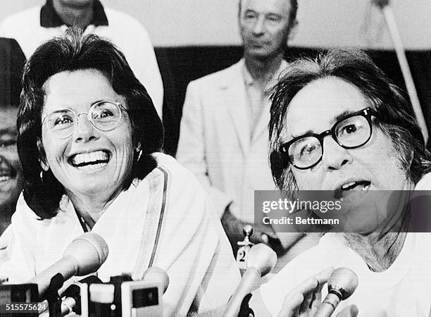 Tennis pro Billie Jean King laughs as Bobby Riggs tells how he intends to beet Ms. King in their $100,000 winner-take-all match in the Astrodome...