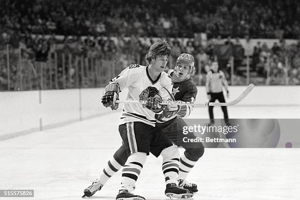 Black Hawks' Bobby Orr and North Stars' Steve Jensen keep one-another in check during the second period of game 10/17. Chicago beat Minnesota 3-0.