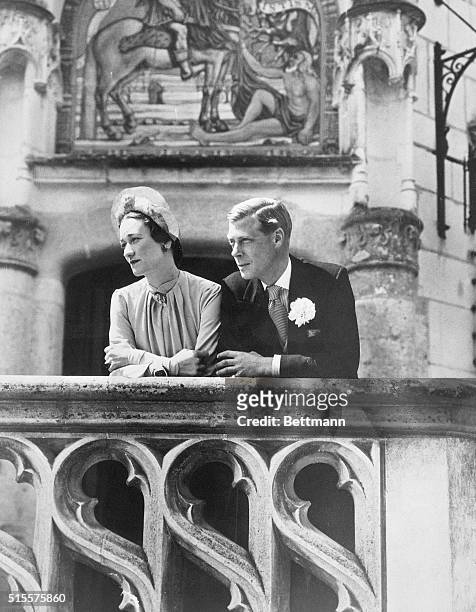 The Duke and Duchess of Windsor gaze from a balcony at the Château de Candé on their wedding day, FRance, 3rd June 1937. Edward VIII's marriage to...