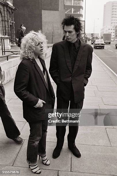 Sid Vicious guitarist with the Sex Pistols, and girlfriend Nancy Spungen from Philadelphia, arrive at court 2/8, where they are charged with having...