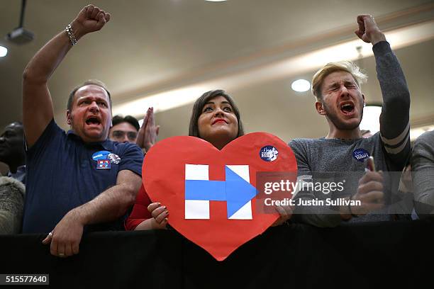 Supporters cheer as Democratic presidential candidate Hillary Clinton speaks during a "Get Out the Vote" event at the Chicago Journeymen Plumbers...