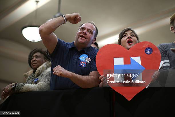 Supporters cheer as Democratic presidential candidate Hillary Clinton speaks during a "Get Out the Vote" event at the Chicago Journeymen Plumbers...