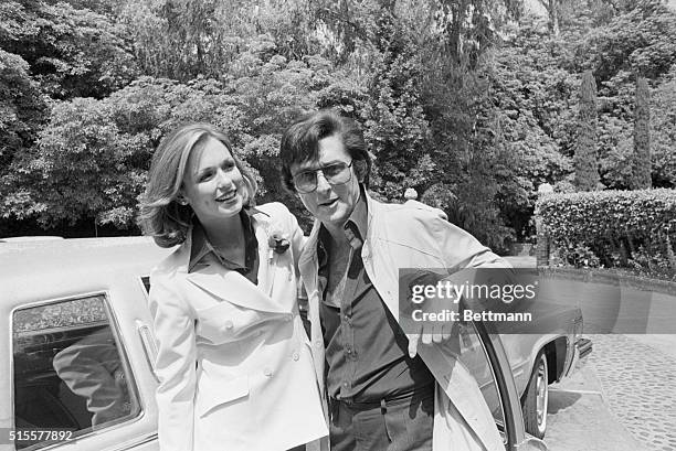 Phyllis George and Robert Evans pause for a picture after exchanging wedding vows under a 400 year old sycamore tree on Evan's Beverly Hills...