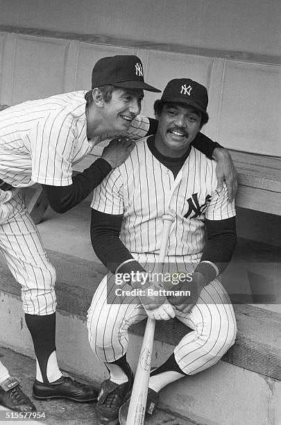 New York Yankee manager Billy Martin puts arms around his newly-acquired superstar, Reggie Jackson, as they meet in the dugout prior to the April 20...