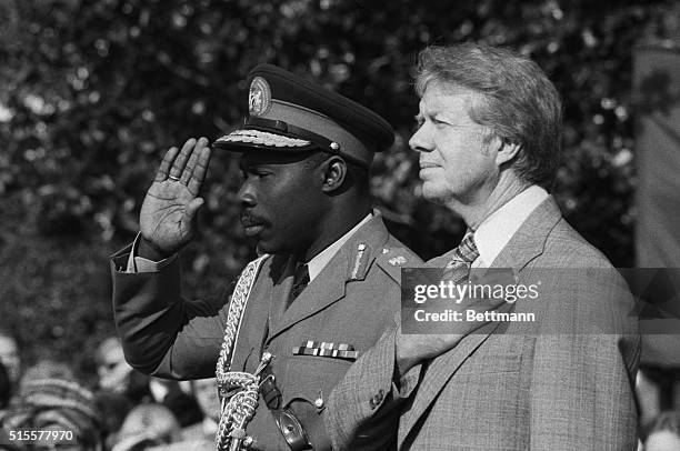 Washington: President Carter and Nigerian head of state Lt. Gen. Olusegun Obassanjo are side-by-side during the playing of the national anthems at...