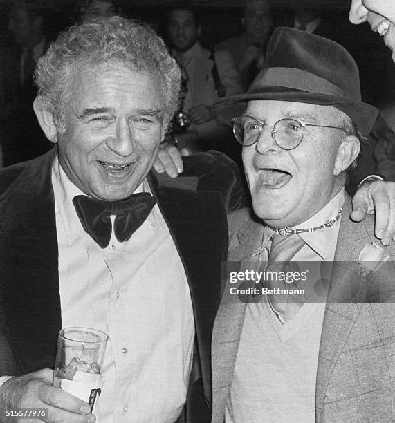 Authors Norman Mailer and Truman Capote share a laugh late 3/21 at the poplular disco New York, New York, during party to celebrate arrival of Dotson...
