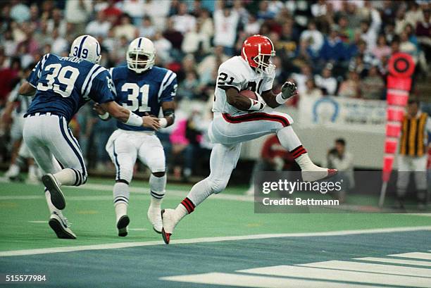 Cleveland Browns running back Eric Metcalf high-steps into the end zone past as he scores a touchdown against the Indianapolis Colts. Colts Mike...