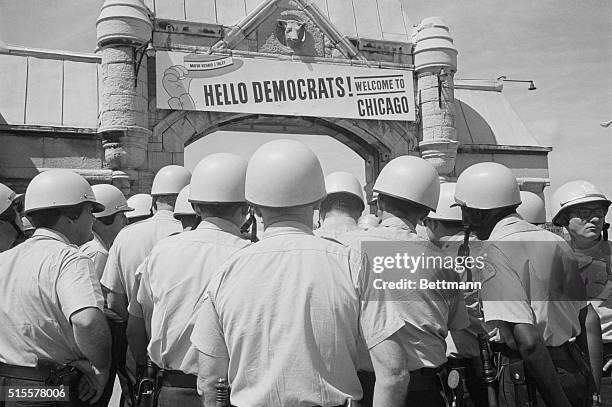 The sign over archway leading to the International Ampithetre welcomes delegates to the Democratic National Convention, but from the sea of police...