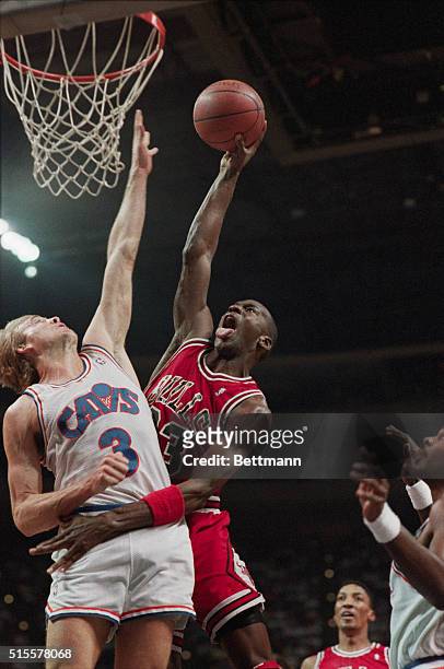 Chicago Bulls guard Michael Jordan shoots the basketball over his defender, Craig Ehlo of the Cleveland Cavaliers. Richfield, Ohio, April 16, 1989.