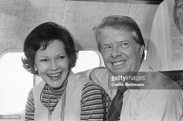 Married couple Rosalynn Carter and former Georgia governor Jimmy Carter, the Democratic presidential candidate, share a moment aboard his campaign...