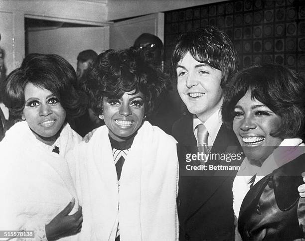 Paul McCartney of The Beatles congratulates The Supremes at a party after their London debut show, 30th January 1968. Left to right: Cindy Birdsong,...