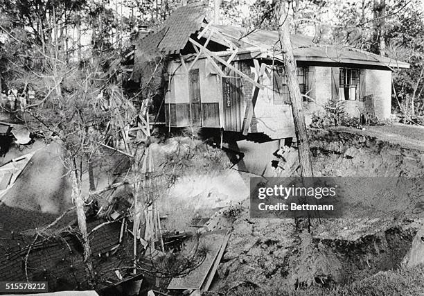 Foot deep sinkhole swallowed much of the home of Mr. And Mrs. R.H. Lawson near Deland, Florida on April 10, taking their two family cars also. The...